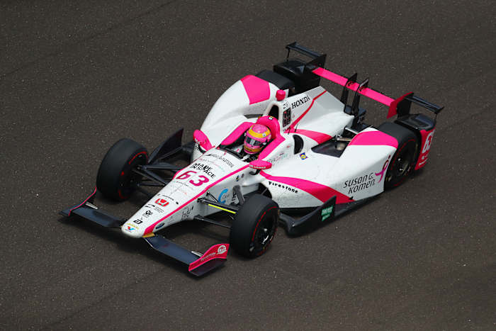 Mann in her pink helmet and car during the 2017 Indy 500. 